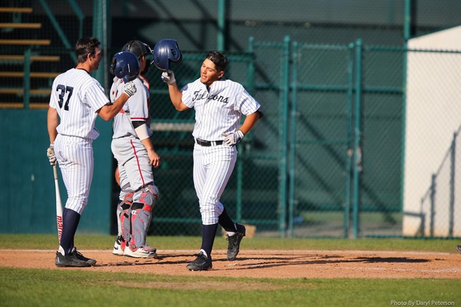 Derrick Edwards (37) greets Ramon Bramasco, who homered and drove in three runs.