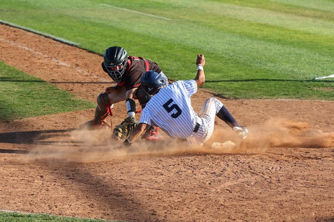 Gabe Gonzalez slides under the tag to score the game-winning run