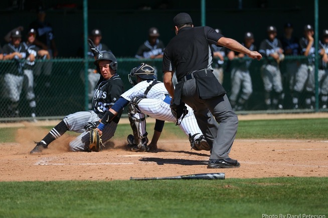 Falcon catcher Andre Alvarez applies the tag at the plate against Rio Hondo