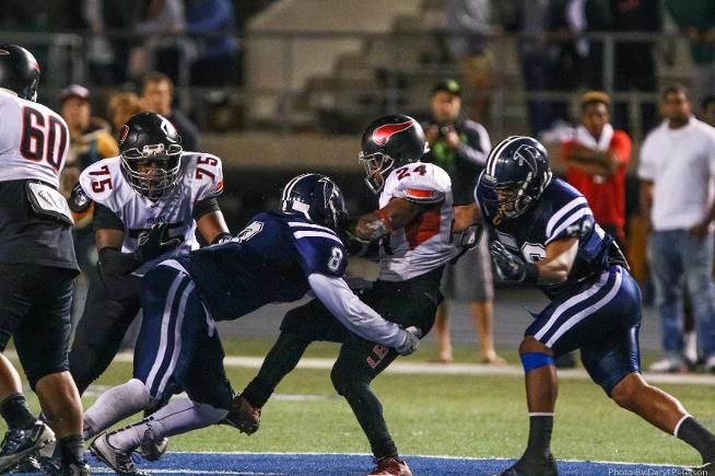 Keith Walker (8) had 10 tackles and was named the Defensive Player of the Game