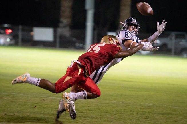 Jacob Gasser pulls in a pass in the Falcons win over College of the Desert
