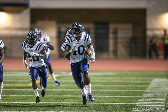 Latrell Stearns (10) returns an interception on a failed FG attempt for an 89-yard TD