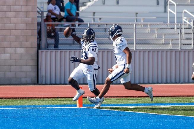 EJ Smith (23) races into the end zone for one of his two interception returns for touchdown