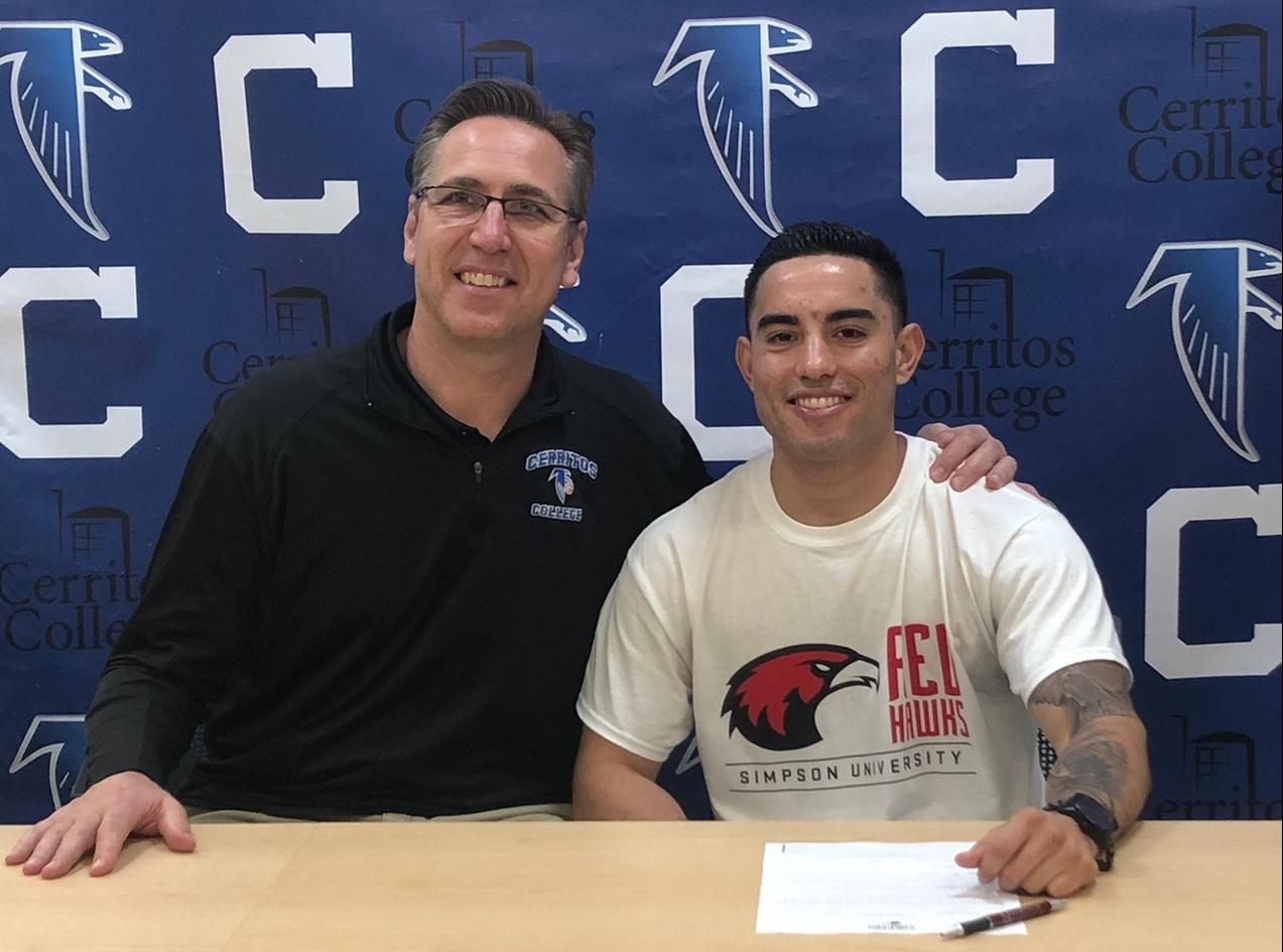 (L-R) Head Coach Russ May and Christian Alvis-Labadie on his signing day