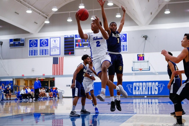 Joshua Belvin scores two of his team-high 19 points in the Falcons win