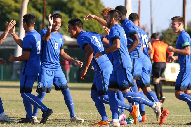 Teammates congratulation Ernesto Cueva (3) after his header in the second minute of the Falcons 5-0 win over El Camino