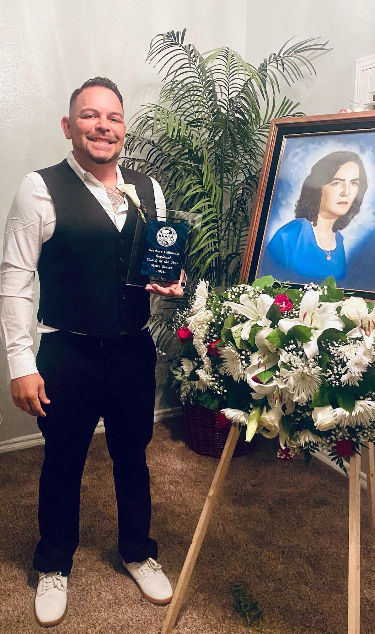 Benny Artiaga with the Southern California Coach of the Year award 