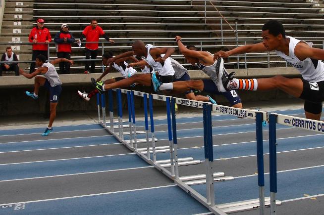Mackenzi Rickman (#8) won the 110-meter HH, with teammate Aaron Martin (#4) taking fifth place