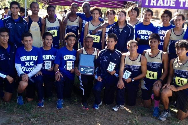 Members of the South Coast Conference championship team gather with trophy. Holding the first place plaque is overall champion Munir Kahssay.