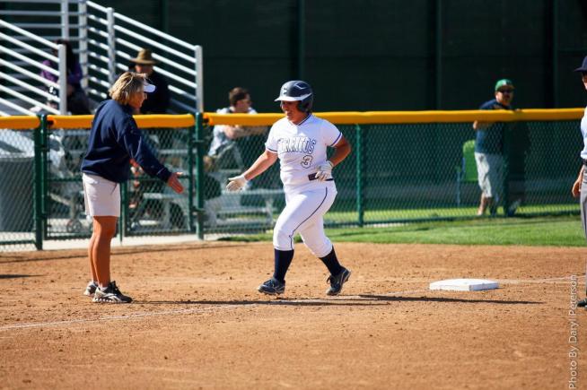 Ariana Mejia is congratulated by head coach Kodee Murray after hitting her third home run of the game in the Falcons 10-0 win over East LA. Mejia drove in eight runs on the day.