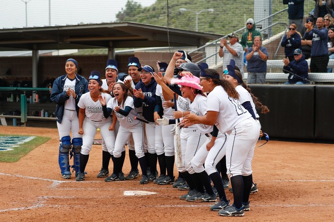 Falcons wait to congratulate Richere Leduc after her three-run home run
