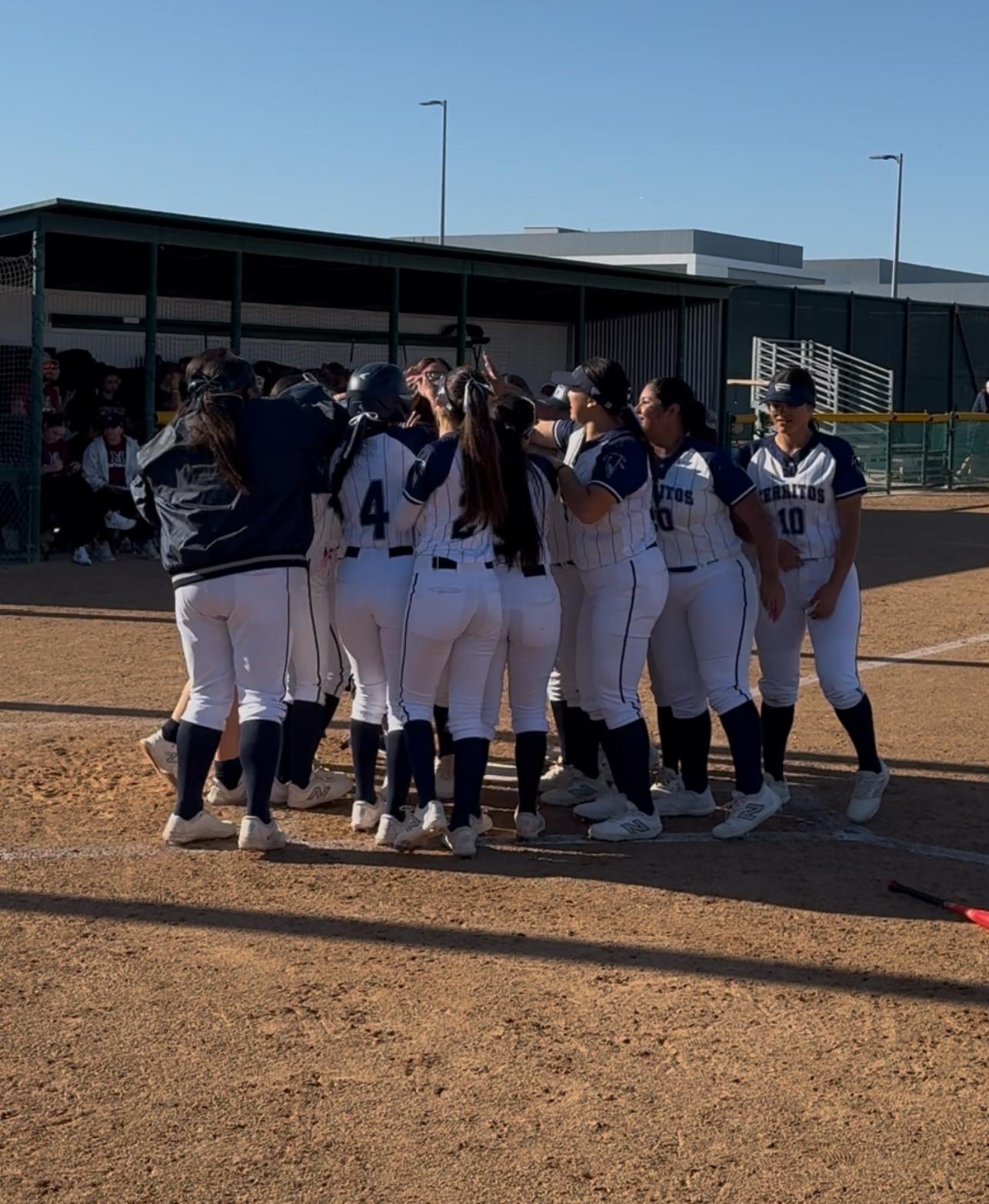 Team celebrates after Valerie Vasquez home run