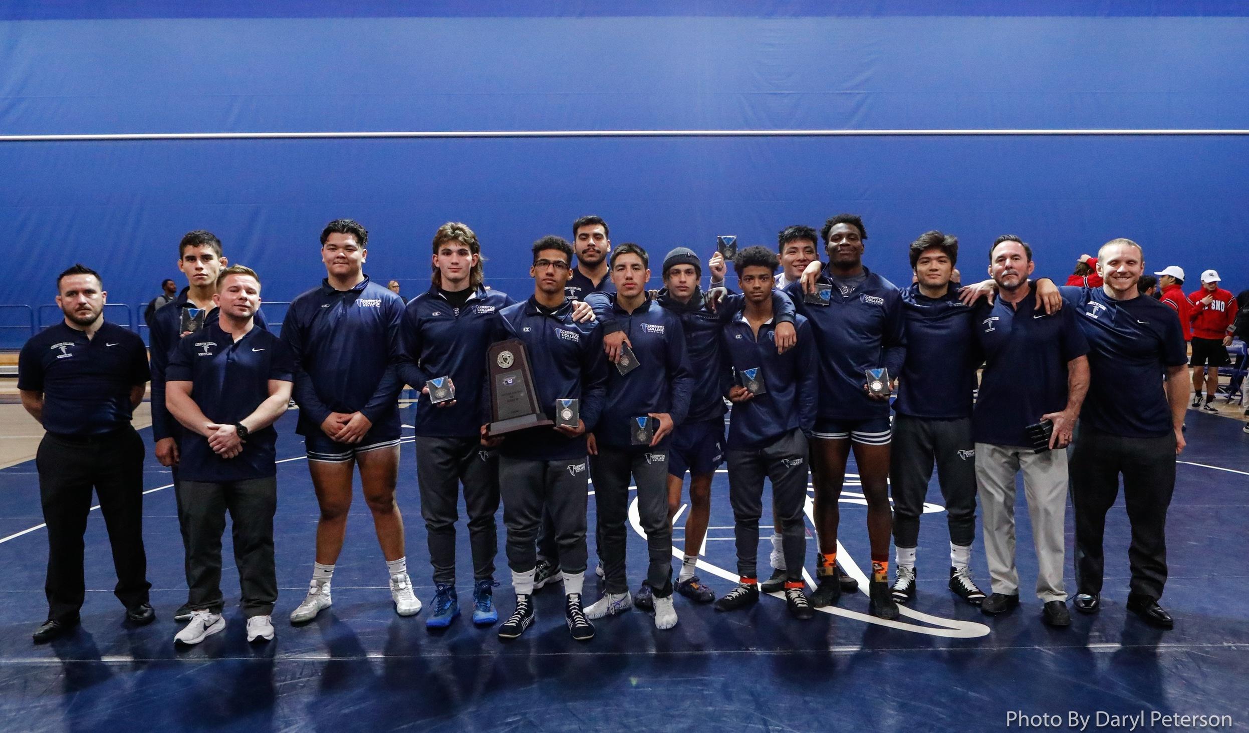 Falcon wrestling with their state team dual runner-up trophy