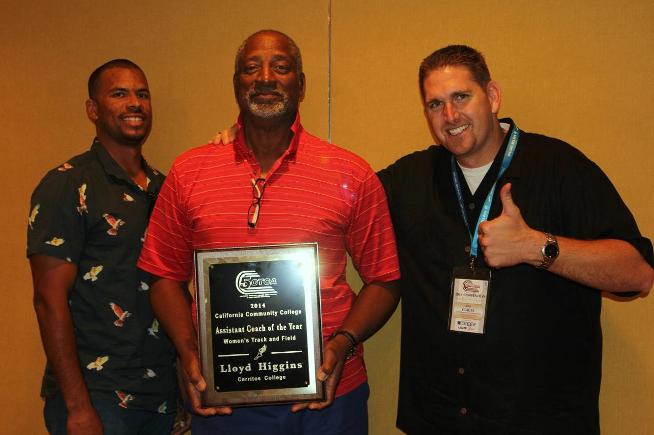 Flanked by Director of Track and Field Chris Richardson and Athletics Director Dan Clauss, Lloyd Higgins receives his Assistant Coach of the Year award.