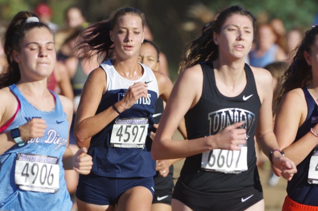 Lauren Berg running for the Falcons at the Highlander Invitational